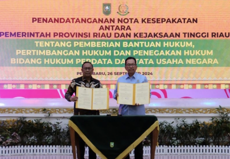 Pj Gubri dan Kajati Riau Tandatangani Nota Kesepahaman Bantuan Hukum